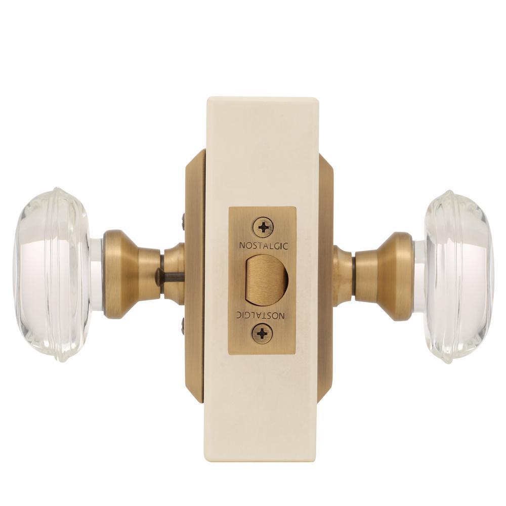 Studio Plate 2-3/4 in. Backset Antique Brass PassaHall/Closet Oval Clear Crystal Glass Door Knob