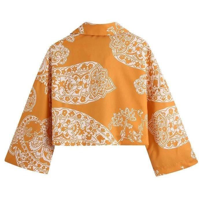 orange paisley print ruched top and high waist skirt