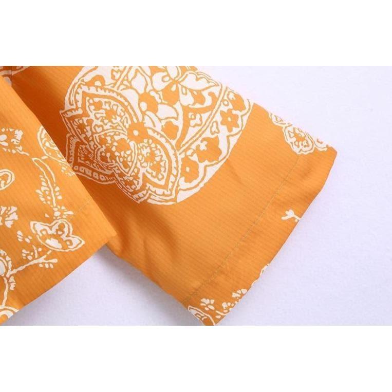 orange paisley print ruched top and high waist skirt
