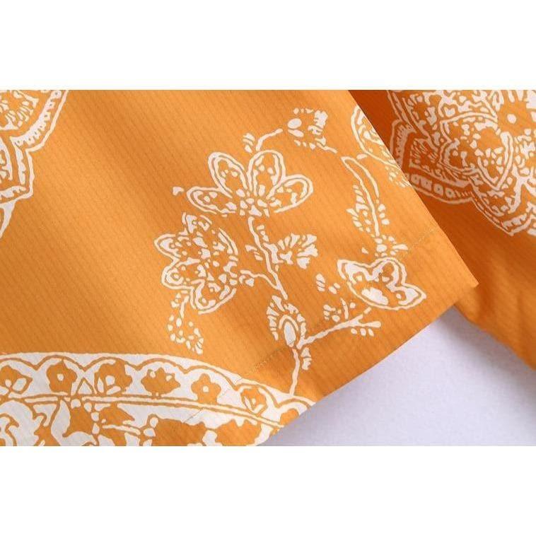 orange paisley print ruched top and high waist skirt