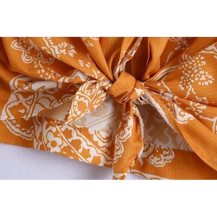 orange paisley print ruched top and high waist skirt