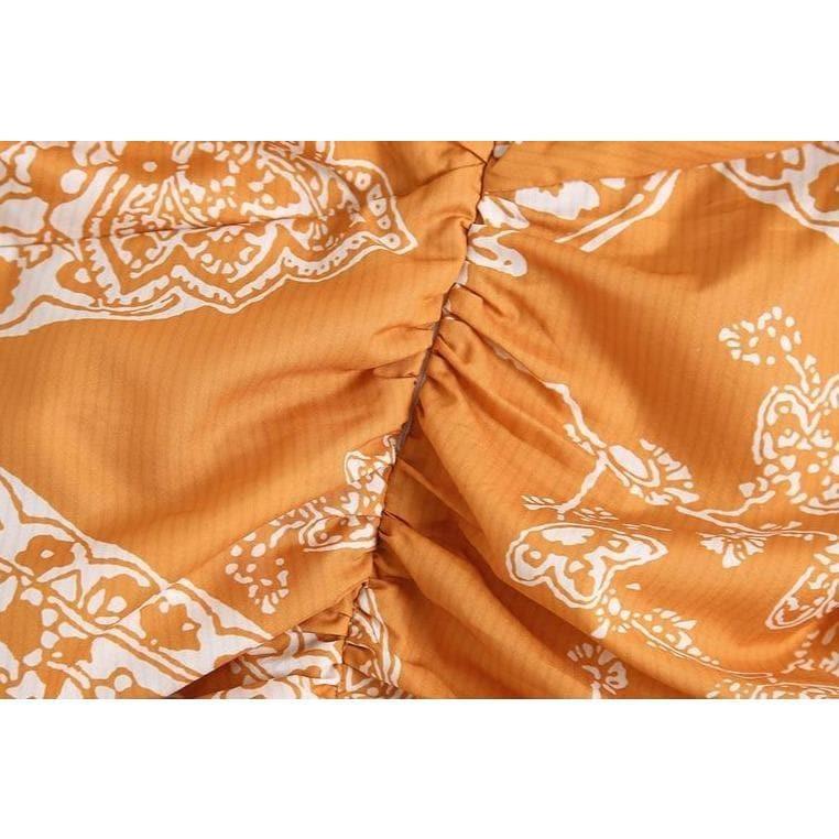 orange paisley print ruched top and high waist skirt