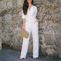 Stocking and delivery of additional Lapel Plain Belted White Jumpsui