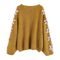 pink embroidered sweater