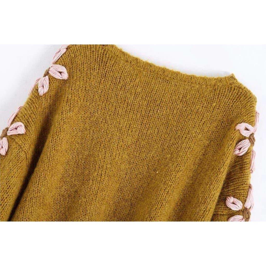 pink embroidered sweater