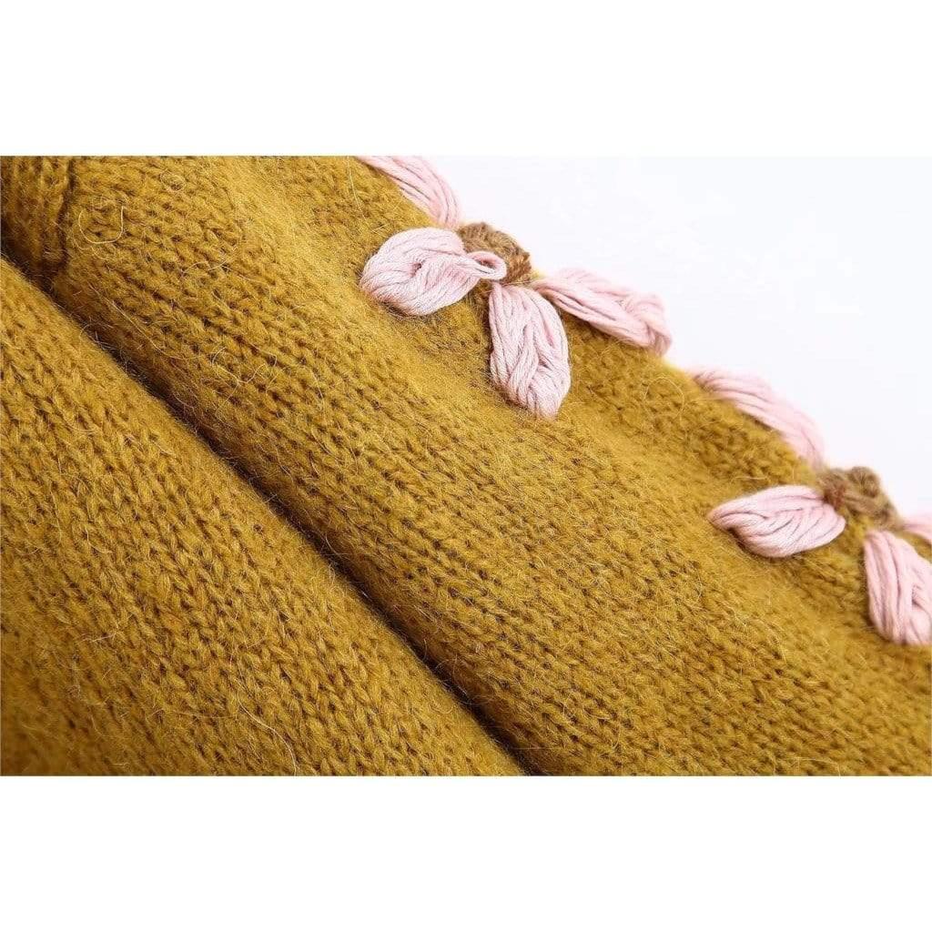 pink embroidered sweater