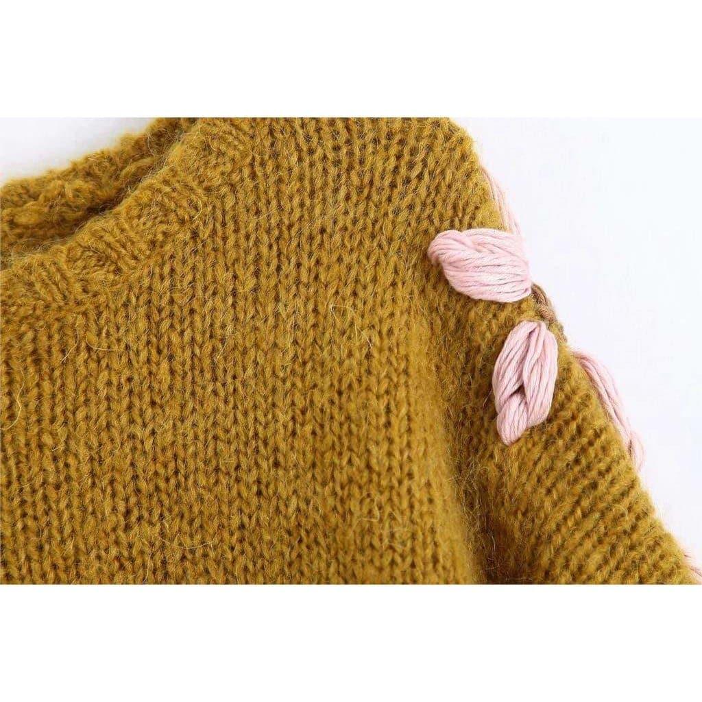 pink embroidered sweater