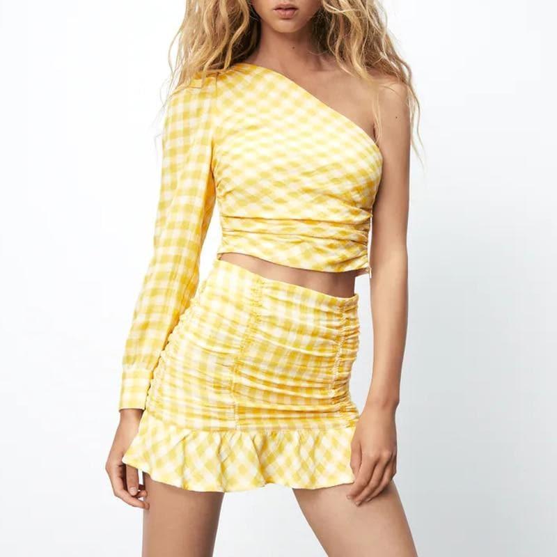 one shoulder crop top and plaid ruched skirt