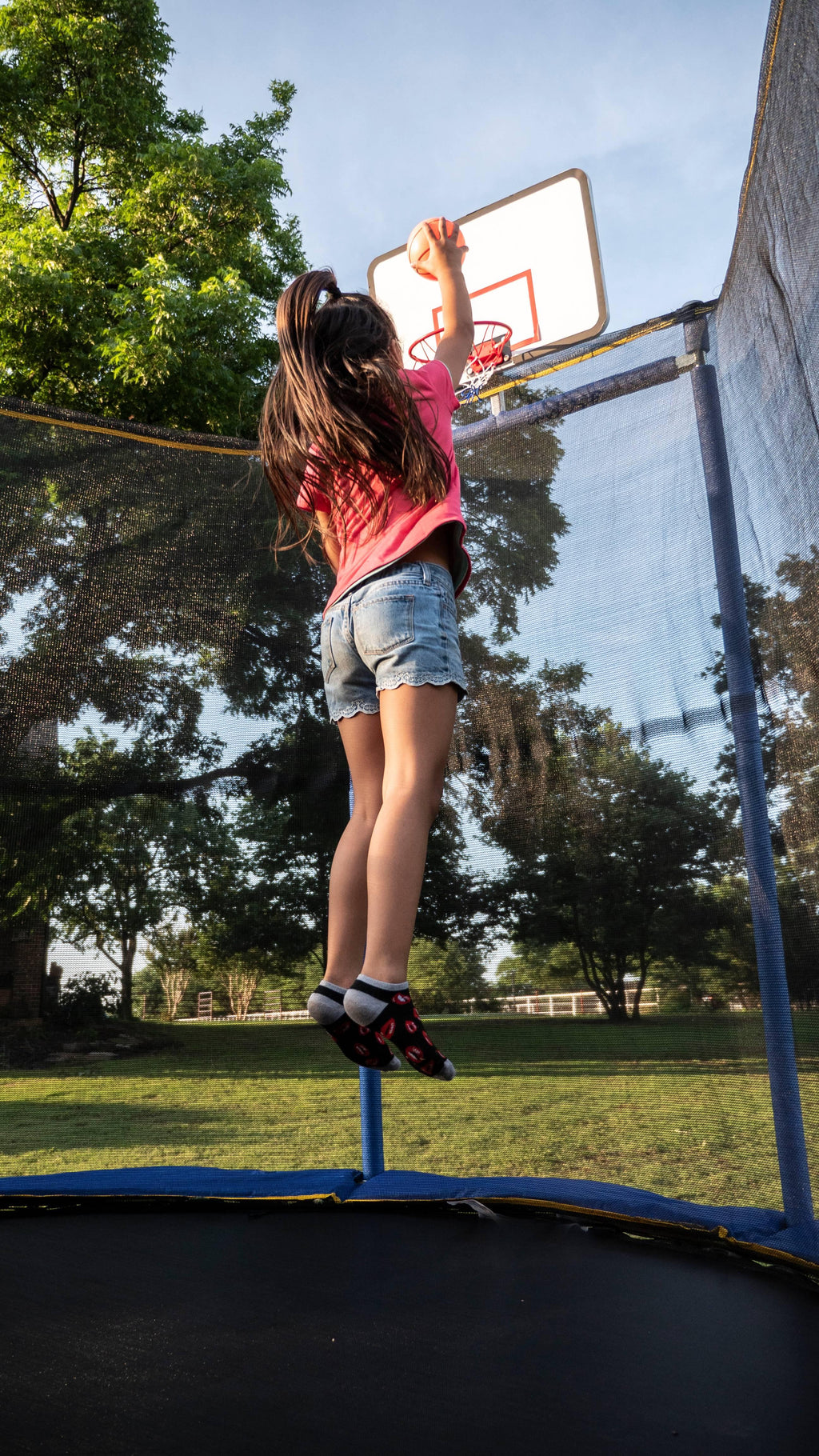 JumpOval 10' x 15' Trampoline, with Two Basketball Hoops, Blue/Yellow