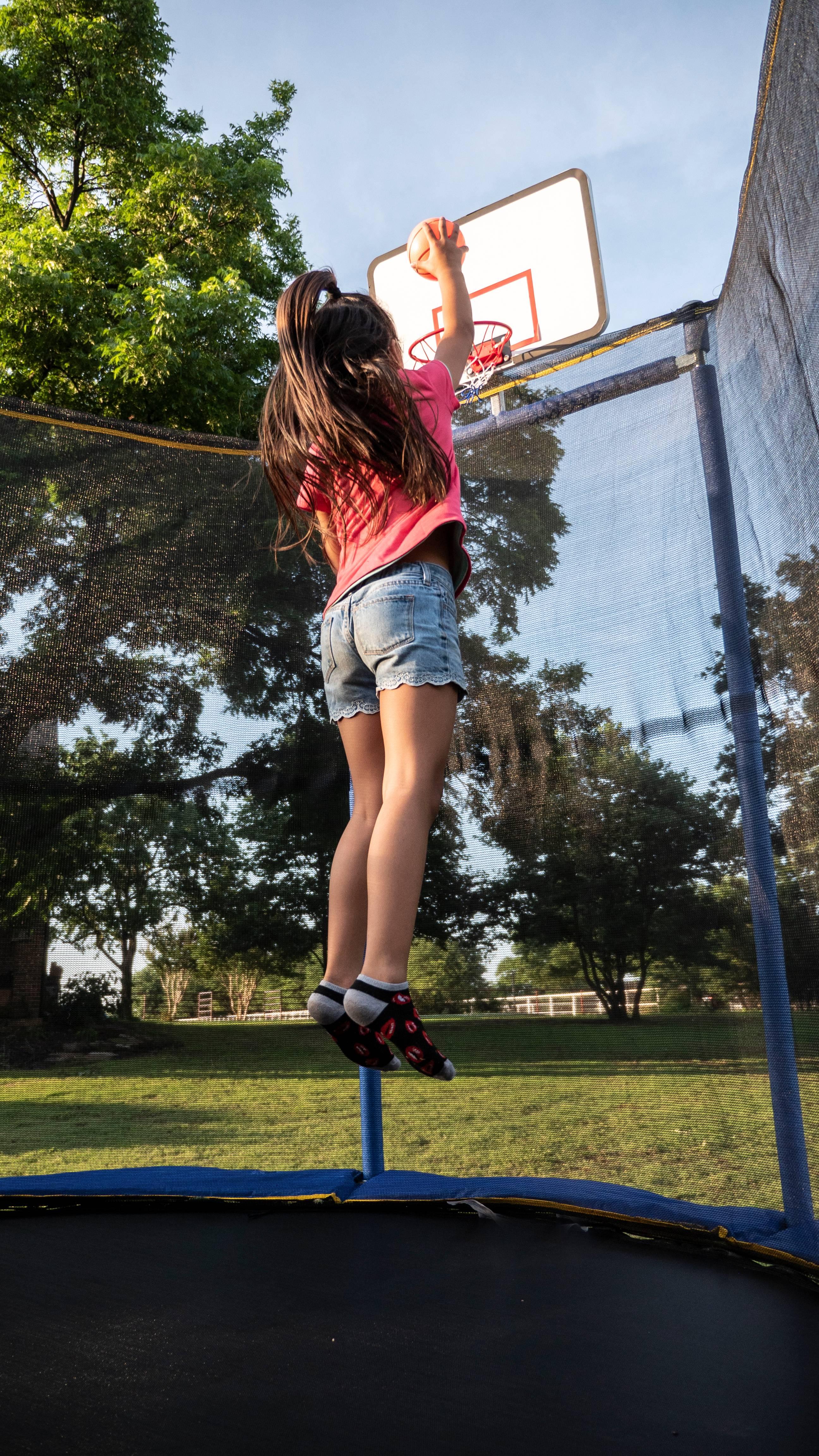 JumpOval 10' x 15' Trampoline, with Two Basketball Hoops, Blue/Yellow
