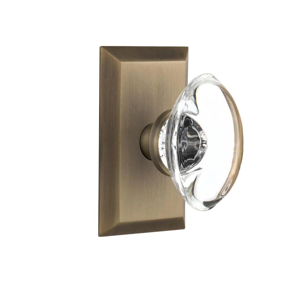 Studio Plate 2-3/4 in. Backset Antique Brass Privacy Bed/Bath Oval Clear Crystal Glass Door Knob