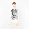 white embroidered sweater