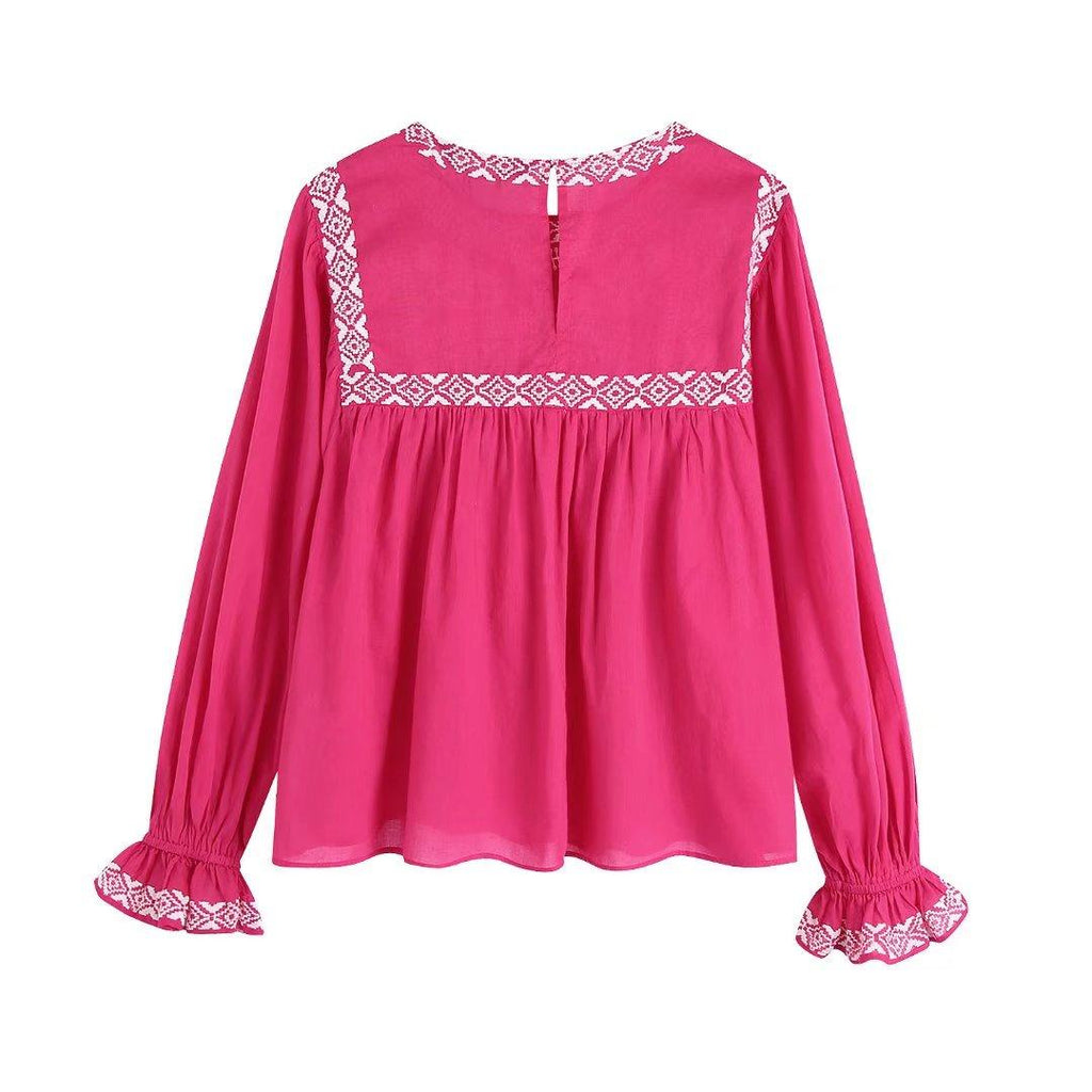 pink pleated blouse