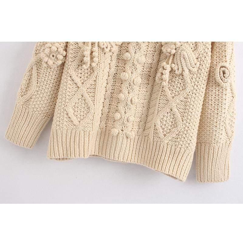beige criss-cross sweater