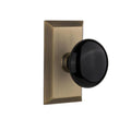Studio Plate 2-3/4 in. Backset Antique Brass PassaHall/Closet Black Porcelain Door Knob