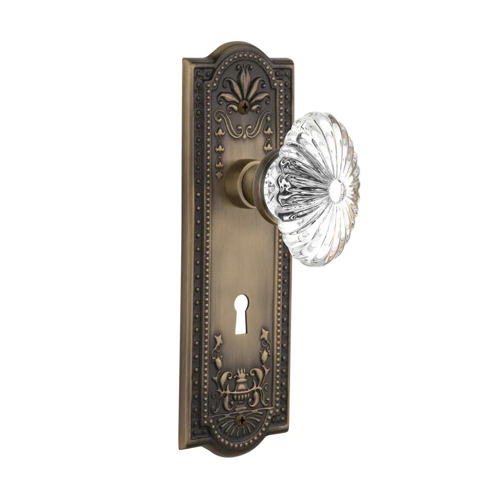 Meadows Plate with Keyhole 2-3/8 in. Backset Antique Brass Privacy Bed/Bath Oval Fluted Crystal Glass Door Knob