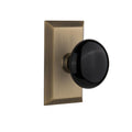 Studio Plate Double Dummy Black Porcelain Door Knob in Antique Brass