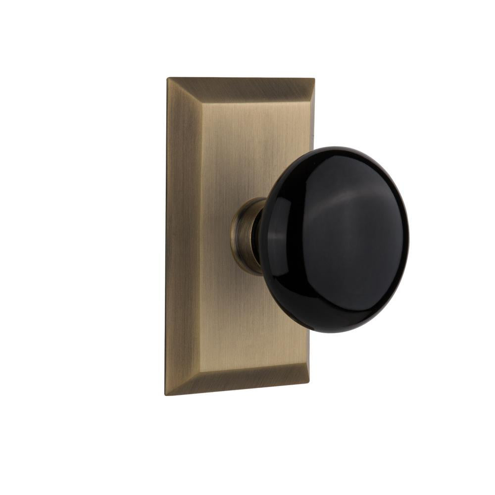 Studio Plate Double Dummy Black Porcelain Door Knob in Antique Brass